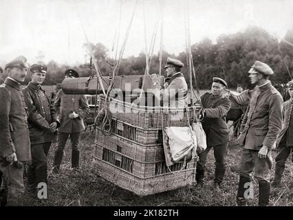 A German observation balloon fitted with a long-distance camera. 1916. They were employed as an aerial platform for intelligence gathering and artillery spotting. The balloons were filled with hydrogen gas, whose flammable nature led to the destruction of hundreds of balloons on both sides. Typically, balloons were tethered to a steel cable attached to a winch that reeled the gasbag to its desired height (usually 1,000-1,500 metres) and retrieved it at the end of an observation session. Stock Photo