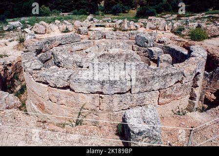 The Tholos at Epidaurus - a small city (polis) in ancient Greece, on the Argolid Peninsula at the Saronic Gulf, best known for its ancient Greek sanctuary. March 1980. Archival scan from a slide. Stock Photo