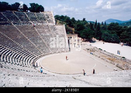 Theatre at Epidaurus - a small city (polis) in ancient Greece, on the Argolid Peninsula at the Saronic Gulf, best known for its ancient Greek sanctuary. March 1980. Archival scan from a slide. Stock Photo