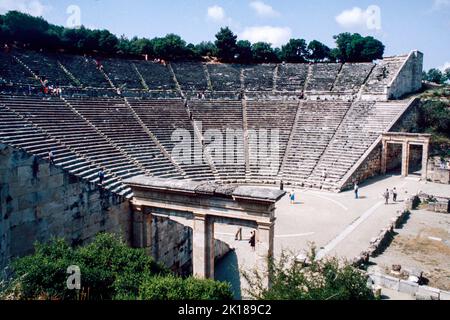 Theatre at Epidaurus - a small city (polis) in ancient Greece, on the Argolid Peninsula at the Saronic Gulf, best known for its ancient Greek sanctuary. March 1980. Archival scan from a slide. Stock Photo