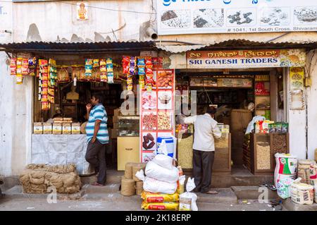 Mysore, Karnataka, India : Two men stand outside a shop in Central Mysore. Stock Photo