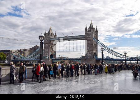 London, England, UK. 16th Sep, 2022. Mourners wait next to Tower Bridge. The queue for Queen Elizabeth II's lying-in-state stretches for several miles, as mourners wait for hours to view The Queen's coffin. The coffin has been placed in Westminster Hall in the Palace of Westminster where she will remain until her funeral on 19th September. Credit: ZUMA Press, Inc./Alamy Live News