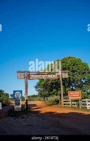 The entrance gate of the Transpantaneira Road to the Northern Pantanal, State of Mato Grosso, Brazil. Stock Photo