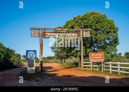 The entrance gate of the Transpantaneira Road to the Northern Pantanal, State of Mato Grosso, Brazil. Stock Photo