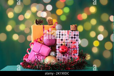 Christmas gifts,decoration and balls with bokeh christmas lights background. Stock Photo