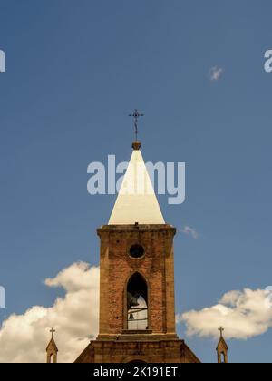 The tower of the main church of the town of Raquira in the central Andean mountains of Colombia. Stock Photo