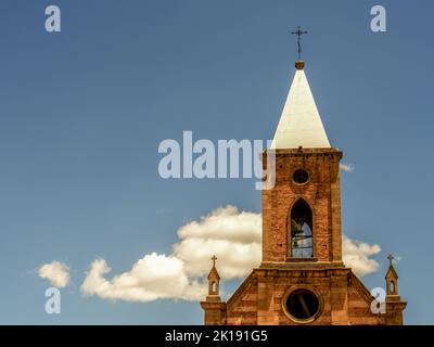 The tower of the main church of the town of Raquira in the central Andean mountains of Colombia. Stock Photo