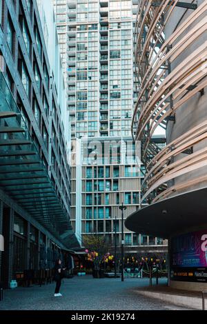 A vertical shot of a modern glass architectural building with ...