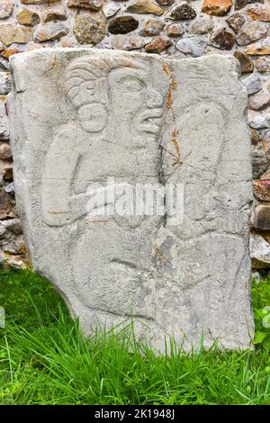 The famous Los Danzantes, carved stone monuments next to building L, Monte Alban Archeological site, Zapotec civilization ruins, Oaxaca, Mexico Stock Photo