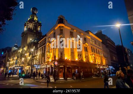 The Chandos pub, a popular pub in London's West End, and London Coliseum theatre, Covent Garden, London, England, UK Stock Photo