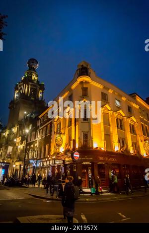 The Chandos pub, a popular pub in London's West End, and London Coliseum theatre, Covent Garden, London, England, UK Stock Photo