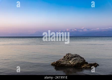 Evening mood on the beach at Kalamaki, Corfu island, Greece Stock Photo