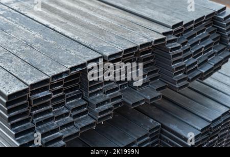 Metal profiles stacked on pallets. Metal products and metallurgical industry. Stock Photo