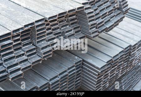 Metal profiles stacked on pallets. Metal products and metallurgical industry. Stock Photo