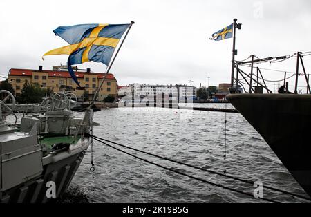 Marinmuseum (previously: Shipyard Museum, Varvsmuseet; alternate: Naval Dockyard Museum; translation: Naval Museum) is a maritime museum located on Stumholmen island, in Karlskrona, Sweden. In the picture: Historic naval ships outside the museum, HMS Bremön to the left. Stock Photo