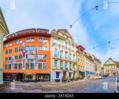 LUCERNE, SWITZERLAND - MARCH 30, 2022: Panorama of townhouses with historical murals on Weinmarkt square, on March 30 in Lucerne, Switzerland Stock Photo