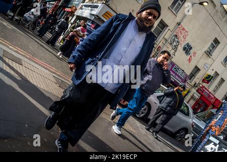 People walking on Whitechapel Road, Tower Hamlets, London, UK Stock Photo