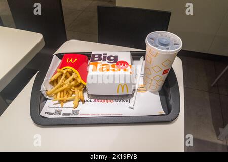 Zagreb, Croatia - June 2, 2022: McDonald's menu with french fries double Big Tasty Bacon sandwich and Coca-Cola. Stock Photo