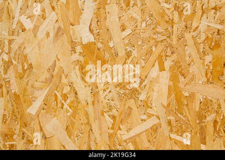 Pressed yellow wood chipboard background pattern texture. Stock Photo
