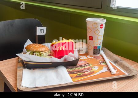 Bratislava, Slovakia - May 31, 2022: McDonald's menu with Double Big Tasty Bacon sandwich, french fries and cup with Coca-Cola. Stock Photo