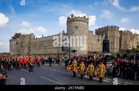 Crowds sang the national anthem and gave three cheers for King Charles III during a proclamation ceremony in Windsor at the Queen Victoria statue. Stock Photo