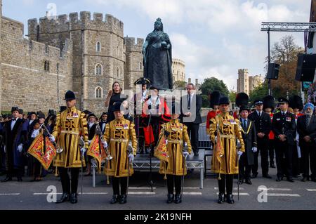 Crowds sang the national anthem and gave three cheers for King Charles III during a proclamation ceremony in Windsor at the Queen Victoria statue. Stock Photo