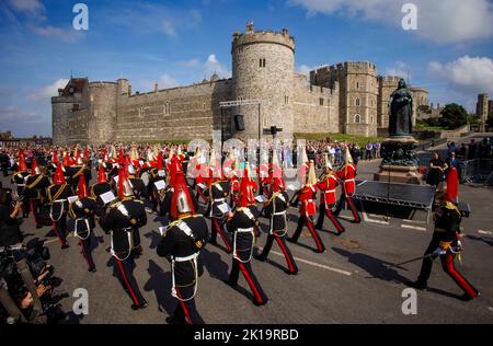 Crowds sang the national anthem and gave three cheers for King Charles III during a proclamation ceremony in Windsor at the Queen Victoria statue. Stock Photo