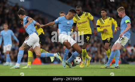 Manchester City's Rodri battles for possession with Borussia Dortmund's Anthony Modeste during the UEFA Champions League Group G match between Manchester City and Borussia Dortmund at the Etihad Stadium, Manchester on Wednesday 14th September 2022. (Credit: Mark Fletcher | MI News) Credit: MI News & Sport /Alamy Live News Stock Photo