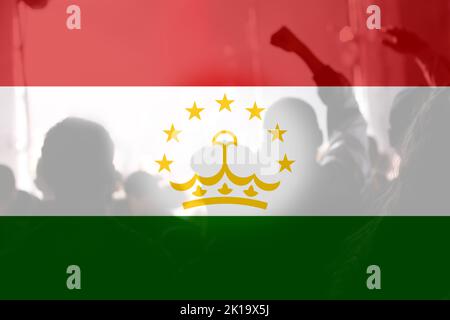 Defocus protest in Tajikistan. Conflict war between Kyrgyzstan and Tajikistan over border. Conflict. Country flag. Out of focus. Stock Photo