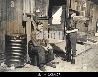 Arrest of Josef Kramer, last Commandant of Auschwitz who moved operations to Bergen-Belsen at the end of 1944 when Auschwitz was evacuated. Kramer is shown under arrest by British military. He was tried as a war criminal and hanged. Stock Photo