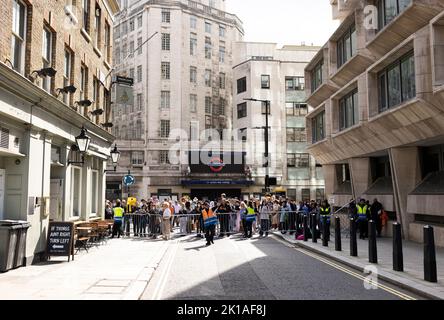 London, UK. 14th Sep 2022.  A security officer clears the area as people try to find a way to watch how coffin with the body of Queen Elizabeth is moved from Buckingham Palace to Westminster Hall, following the death of UK's Queen Elizabeth Kamil Jasnski/Alamy Live News Stock Photo