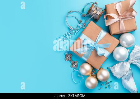 Christmas background with balloons, gifts and decorations on a blue background. Stock Photo