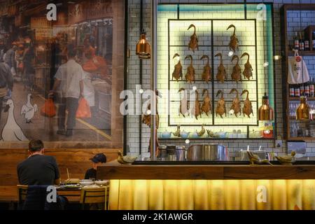 Customers dining at Holy Duck, a modern Asian restaurant near Spice Alley in Chippendale, Sydney — New South Wales, Australia Stock Photo