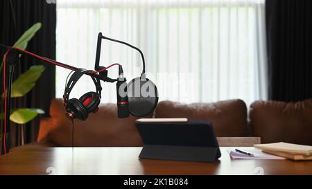 Home studio podcast with professional condenser microphone, tablet and headphone. Technology and audio equipment concept Stock Photo