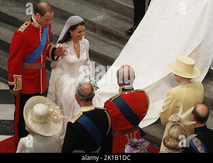 File photo dated 29/04/11 of Prince William and his new bride Kate bow before Queen Elizabeth II following their marriage at Westminster Abbey, London. The late monarch had eight grandchildren, who are performing a vigil around her coffin on Saturday, and 12 great-grandchildren. The Queen was grandmother to eight grandchildren, who all held a deep respect and admiration for their Granny. Peter Phillips, Zara Tindall, the Prince of Wales, the Duke of Sussex, Princess Beatrice, Princess Eugenie, Lady Louise Windsor and Viscount Severn will all honour the late monarch with a vigil around her coff Stock Photo