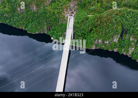 Aerial view of the Fedafjorden bru bridge with crossing power lines and a tunnel portal Stock Photo
