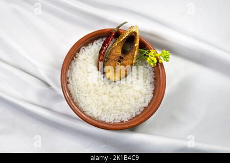 Bengali new year festive dish Boishakh panta ilish with dried chilli and mustard flower. Panta bhat is popular among Bengali's in India and Bangladesh Stock Photo