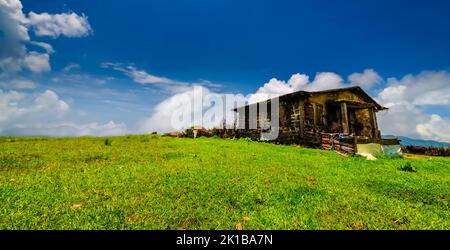 A stone house at an open meadow located outside of Mawsynram, East Khasi Hills, Meghalaya, India. Stock Photo