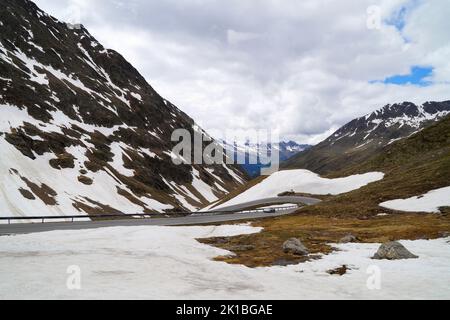 Scenic snowy Timmelsjoch mountain pass connecting Oetztal valley in Austrian state of Tyrol to the Passeier Valley in Italian province of South Tyrol Stock Photo