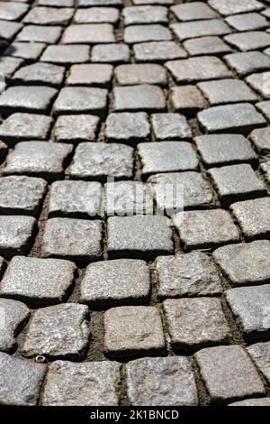 Cobblestone paving on old road background texture Stock Photo