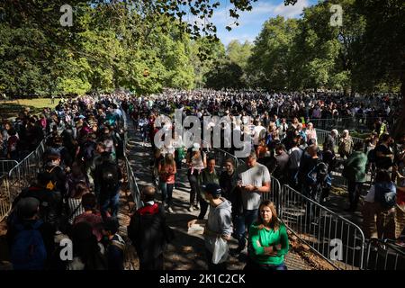 London, UK. 17th Sep, 2022. Numerous people walk in a long queue in Southwark Park at the start of the queue to Westminster Hall to say goodbye at the laid out coffin of Queen Elizabeth II. The British Queen Elizabeth II died on 08.09.2022 at the age of 96. The coffin with the Queen will be laid out in the Palace of Westminster (Parliament) for four days. For September 19, a state ceremony is planned in Westminster Abbey with about 2000 guests and the funeral in Windsor Castle near London. Credit: Christian Charisius/dpa/Alamy Live News Stock Photo