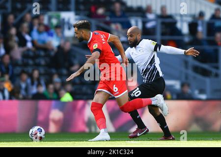 Ryan Tafazolli of Wycombe Wanderers battles with David McGoldrick of Derby County during the Sky Bet League 1 match between Derby County and Wycombe Wanderers at Pride Park, Derby on Saturday 17th September 2022. Stock Photo