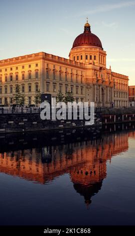 The Berlin City Palace, rebuilt as the Humboldt Forum, reflected in the evening light in the Spree, Mitte district, Berlin, Germany Stock Photo