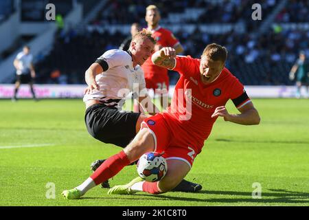 Louie Sibley of Derby County battles with Alfie Mawson of Wycombe Wanderers during the Sky Bet League 1 match between Derby County and Wycombe Wanderers at Pride Park, Derby on Saturday 17th September 2022. Stock Photo