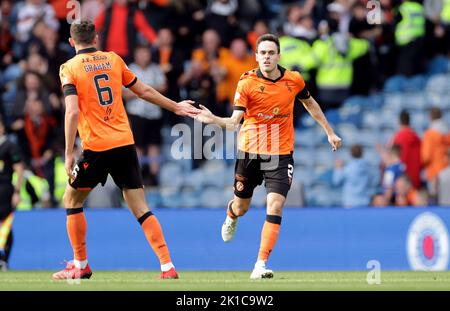 Dundee United's Liam Smith celebrates scoring their side's first goal of the game with team-mate Ross Graham during the cinch Premiership match at Ibrox Stadium, Glasgow. Picture date: Saturday September 17, 2022. Stock Photo