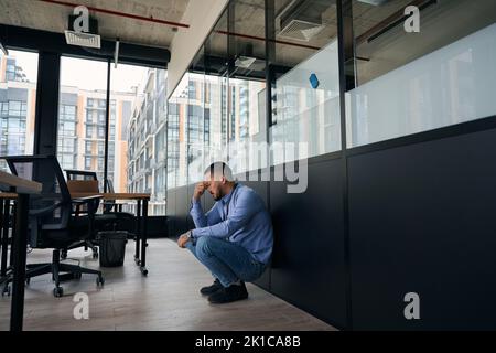 Exhausted office worker suffering from job burnout Stock Photo