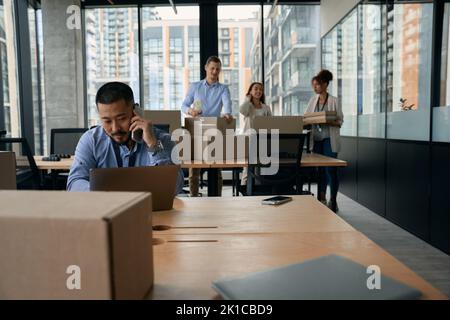 Team of corporate employees preparing for office move Stock Photo