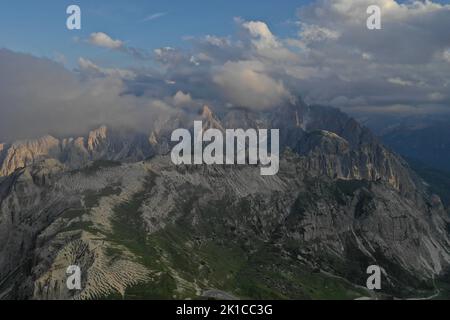 A landscape view of the Alps in Europe, with mountains and forest trees in the background Stock Photo