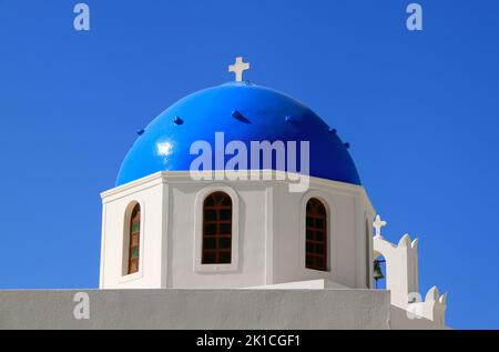 Beautiful blue dome of Anastasis church in Oia, Santorini on a sunny day with blue sky. Stock Photo