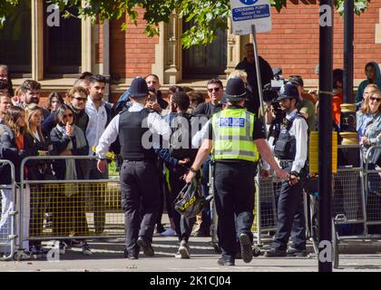 London, UK. 17th Sep, 2022. Met Police arrest a man in a busy Parliament Square. Large crowds continue to gather around the Palace of Westminster, where the Queen's coffin is currently kept. Credit: Vuk Valcic/Alamy Live News Stock Photo